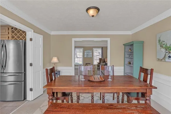 a dining room with furniture a window and chandelier