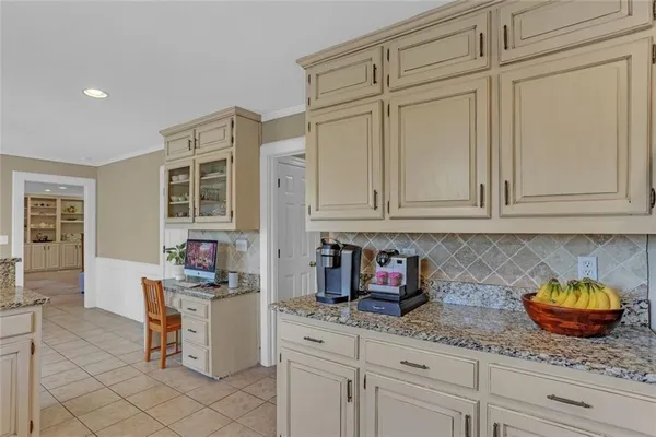 a kitchen with stainless steel appliances granite countertop a sink and cabinets
