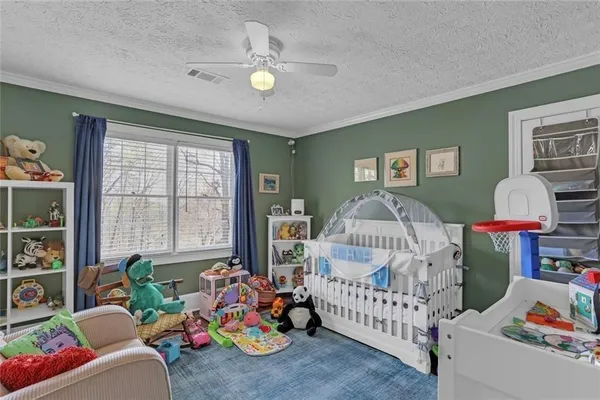 a bedroom with furniture and a window