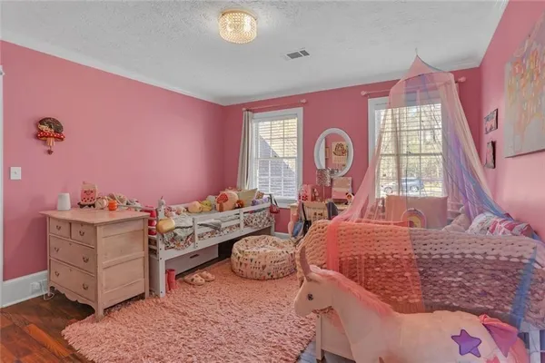 a bed room with a bed and a dresser