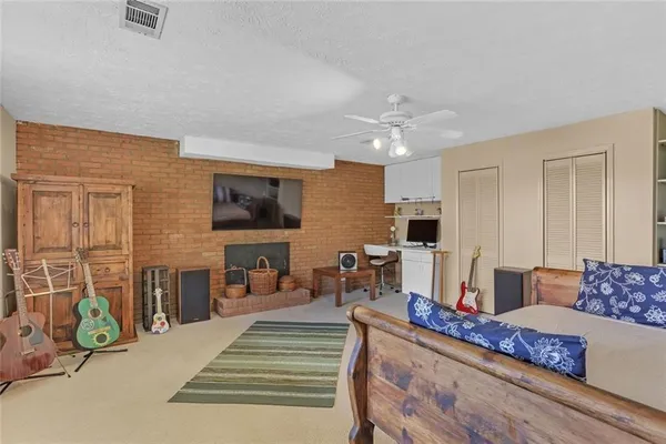 a living room with furniture and flat screen tv
