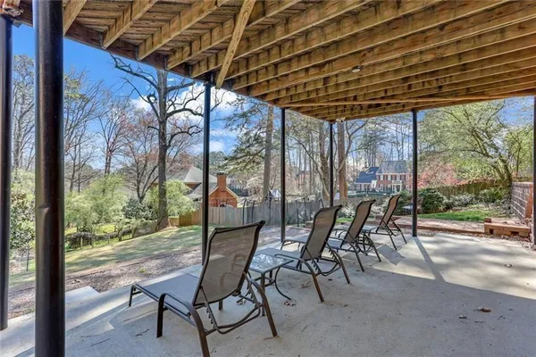 a view of a backyard with sitting area