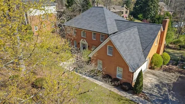 a aerial view of a house with a yard