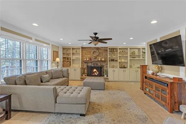 a living room with furniture and a flat screen tv