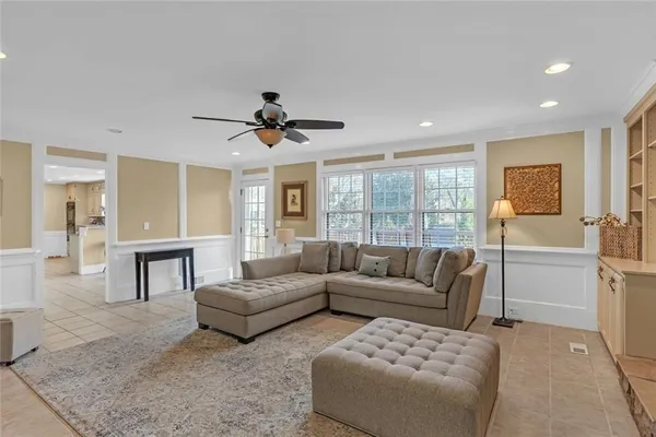 a living room with furniture and a large window