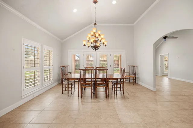 a view of a livingroom with furniture and a chandelier fan