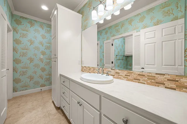 a spacious bathroom with a shower sink and mirror