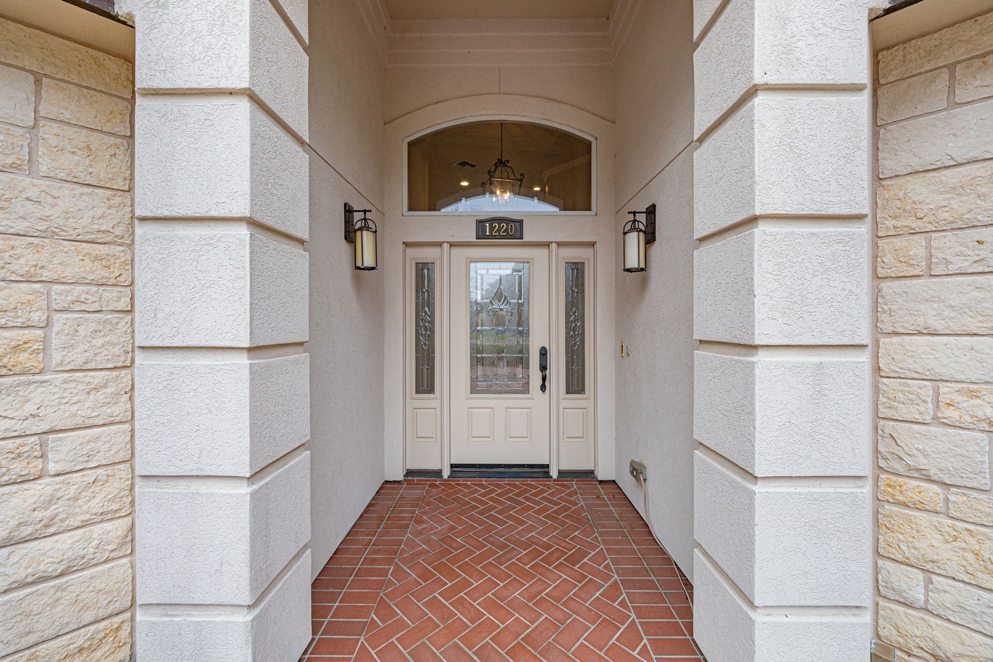 1220 Travis Street Columbus, TX 78934 - Photo 5 of 39 a view of a hallway with wooden floor and staircase