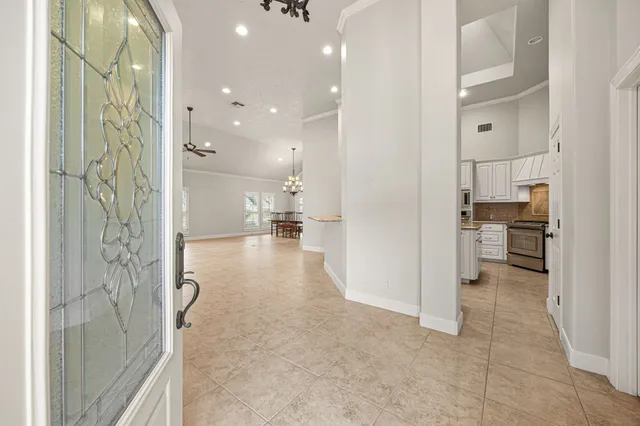 a kitchen with granite countertop a sink and cabinets