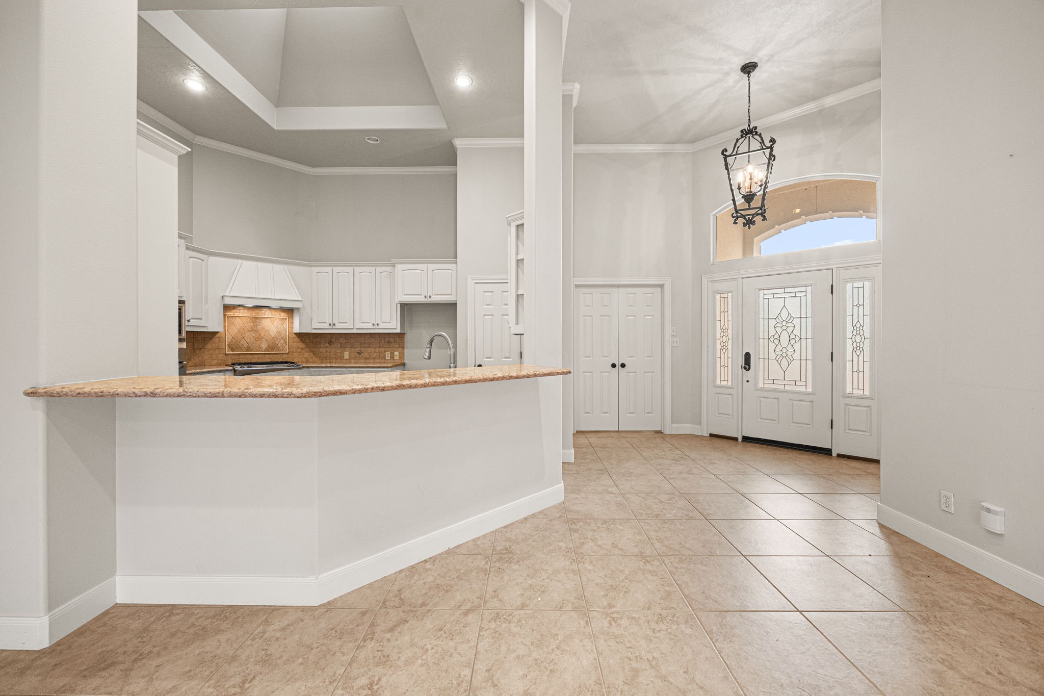 1220 Travis Street Columbus, TX 78934 - Photo 7 of 39 a kitchen with granite countertop a sink and cabinets