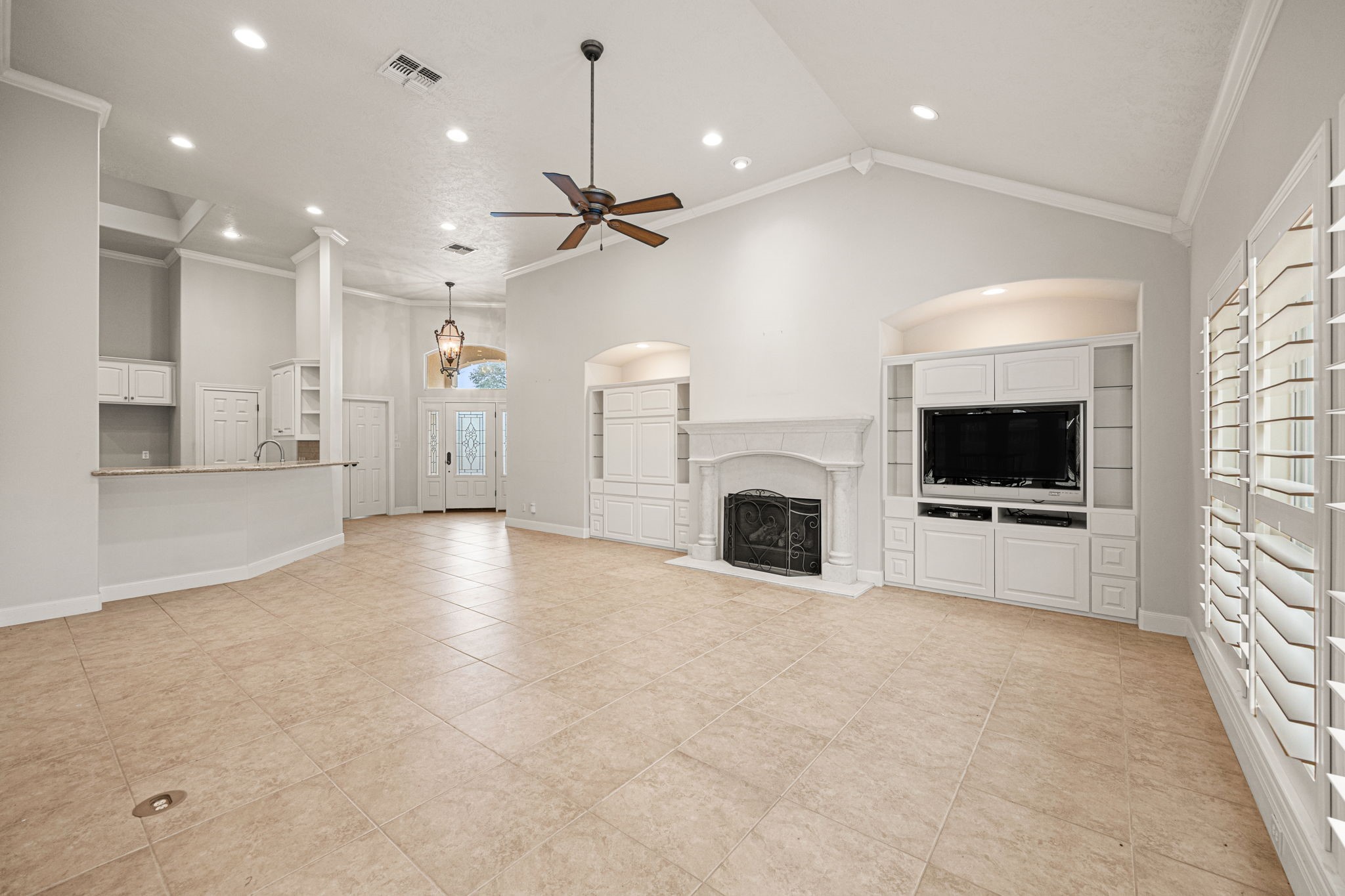 1220 Travis Street Columbus, TX 78934 - Photo 9 of 39 a view of a livingroom with a flat screen tv fire place and a fireplace