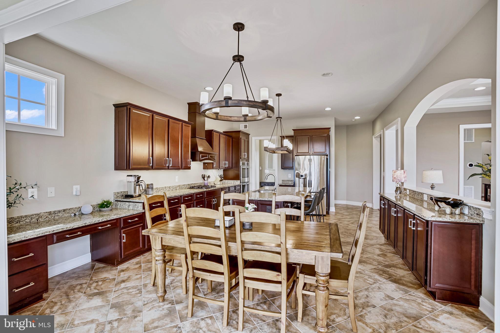 18604 Wild Raspberry Drive Purcellville, VA 20132 - Photo 11 of 58 a view of a dining room with furniture window and wooden floor