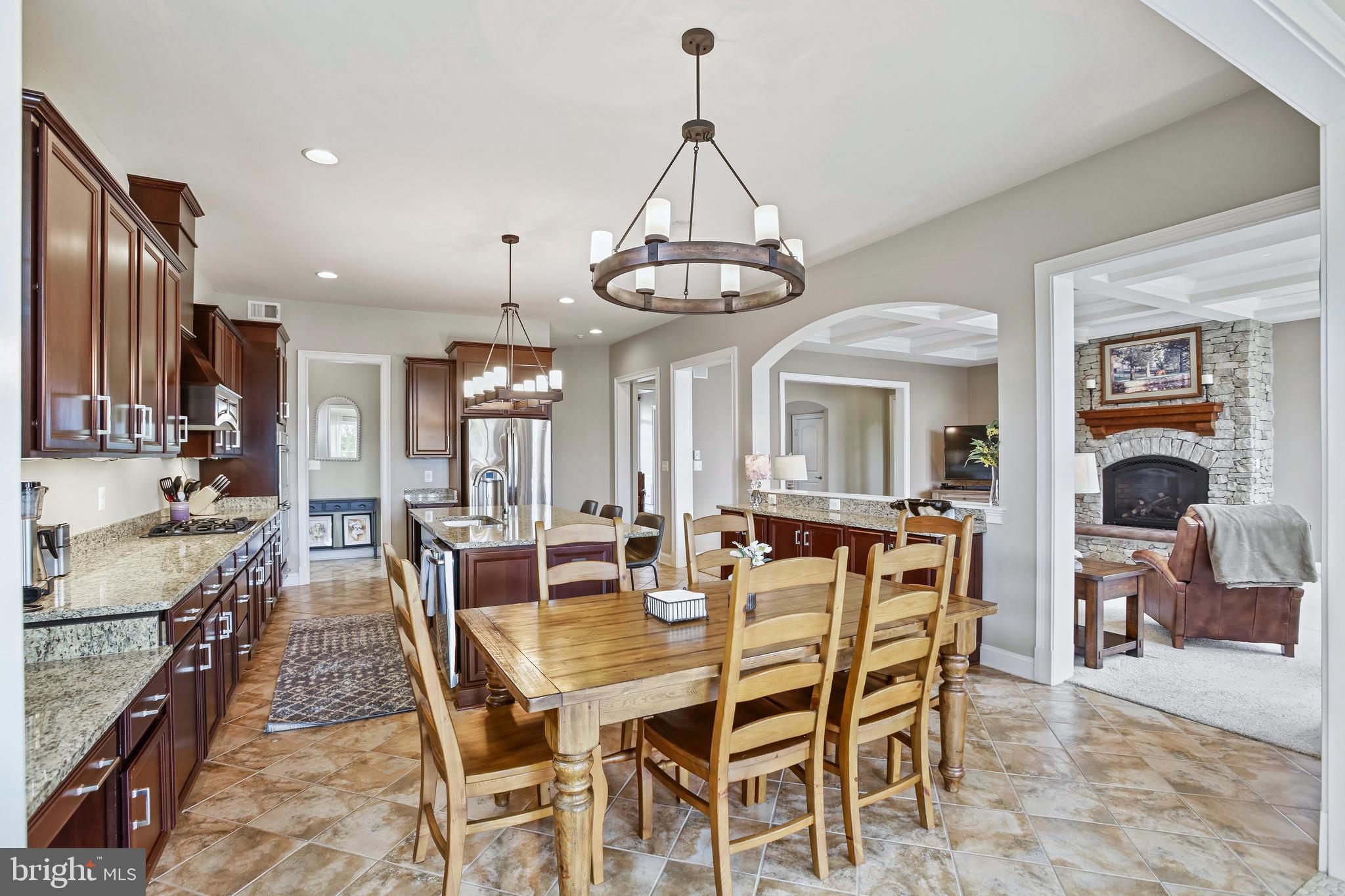 18604 Wild Raspberry Drive Purcellville, VA 20132 - Photo 14 of 58 a view of a dining room with furniture window and wooden floor