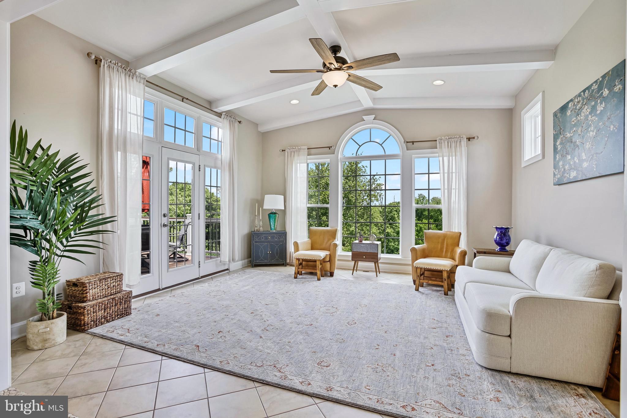18604 Wild Raspberry Drive Purcellville, VA 20132 - Photo 16 of 58 a living room with furniture and a large window