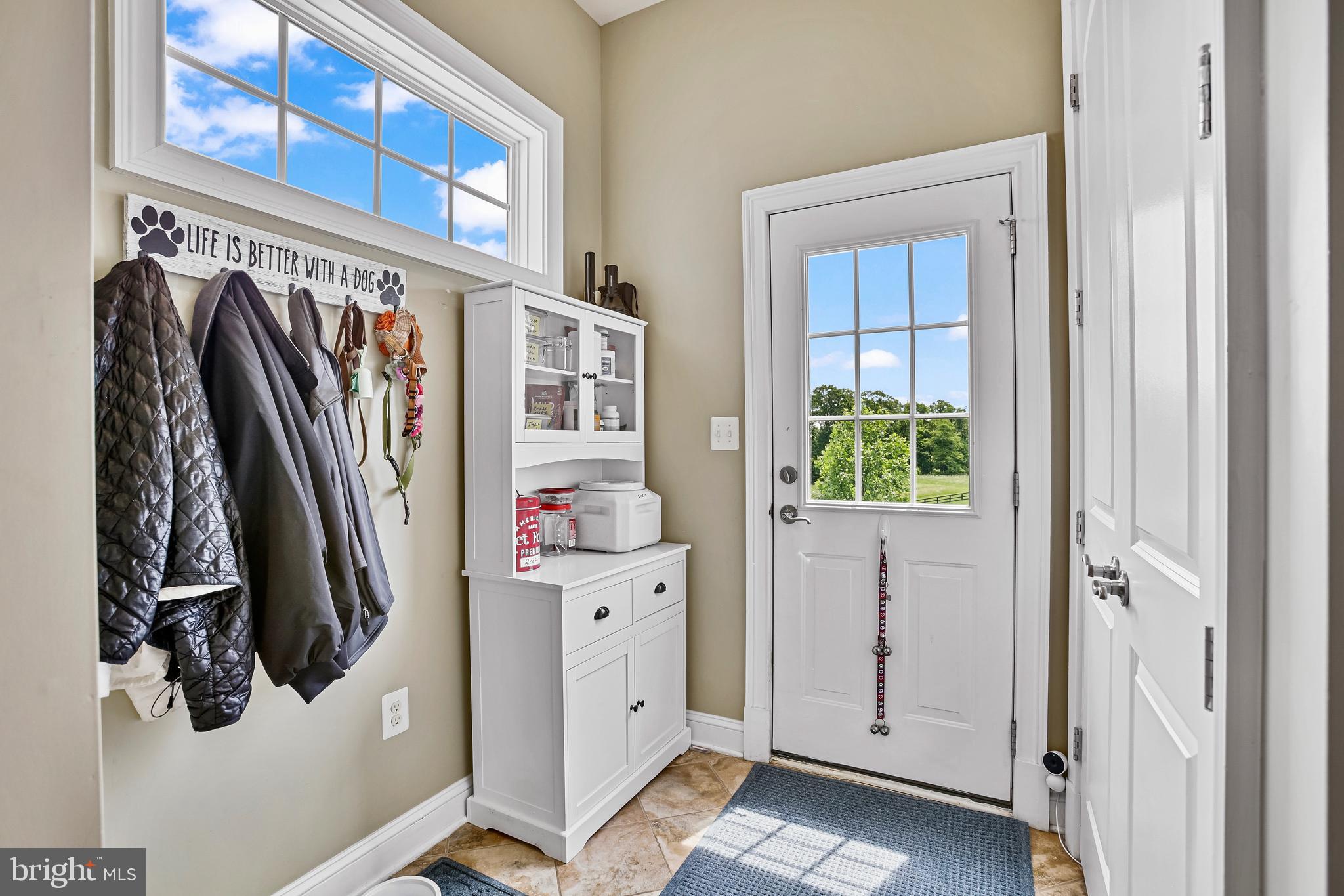 18604 Wild Raspberry Drive Purcellville, VA 20132 - Photo 19 of 58 a view of walk in closet with clothes and shoes