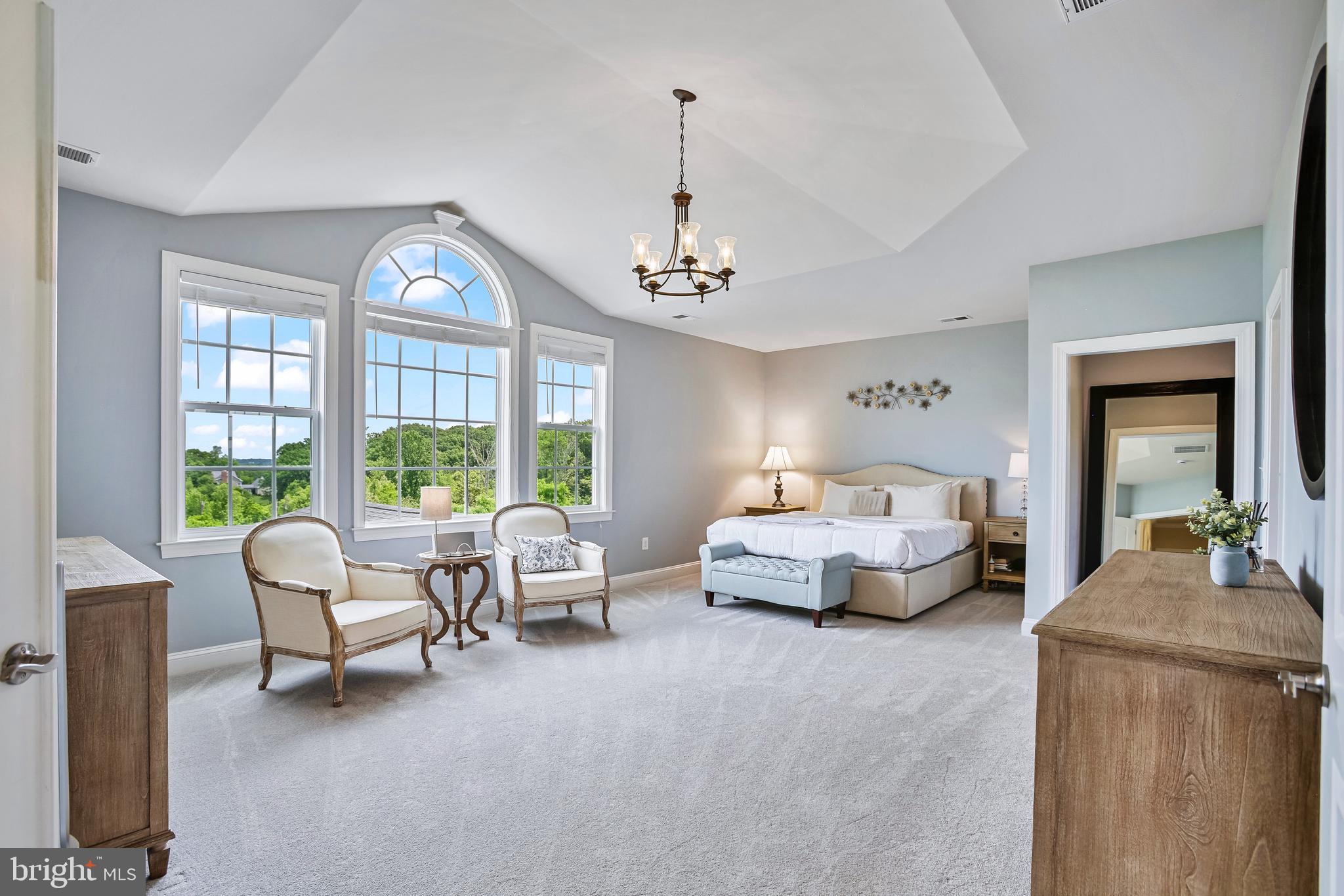 18604 Wild Raspberry Drive Purcellville, VA 20132 - Photo 23 of 58 a living room with furniture and a chandelier