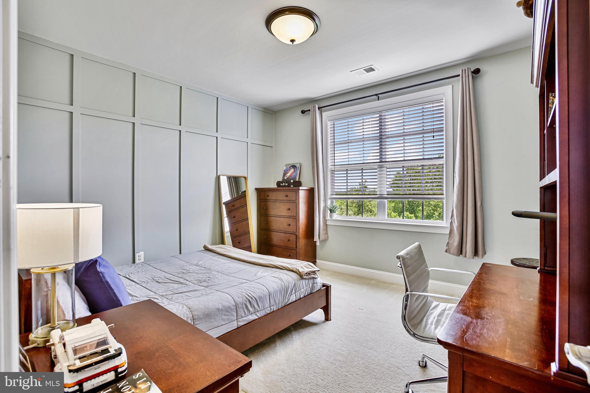 18604 Wild Raspberry Drive Purcellville, VA 20132 - Photo 29 of 58 a bedroom with a bed and wooden floor