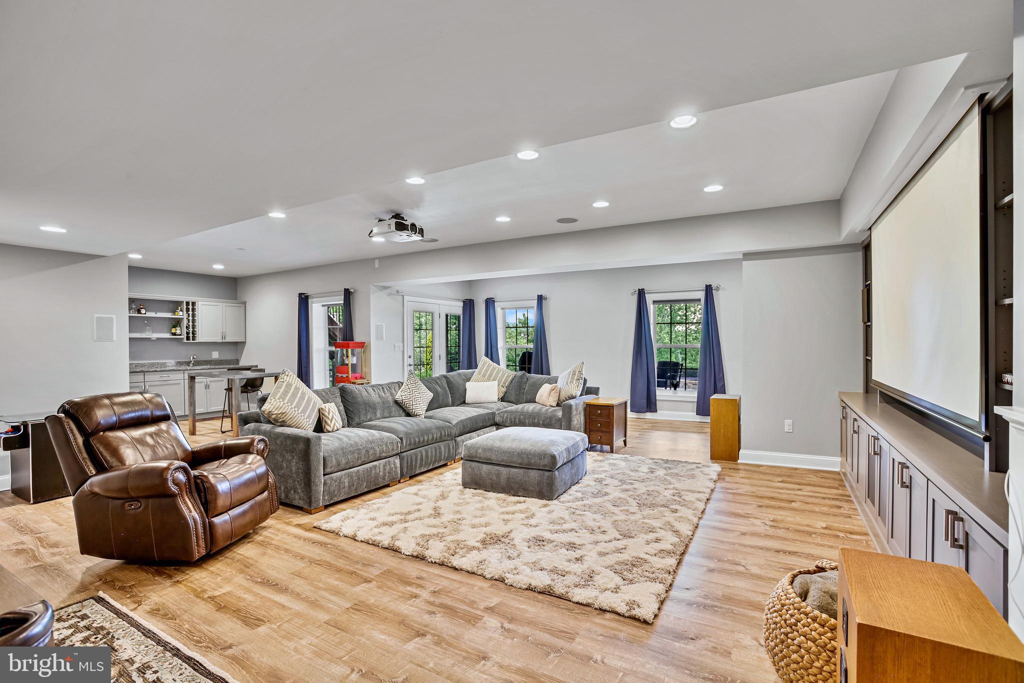18604 Wild Raspberry Drive Purcellville, VA 20132 - Photo 34 of 58 a living room with furniture and a flat screen tv