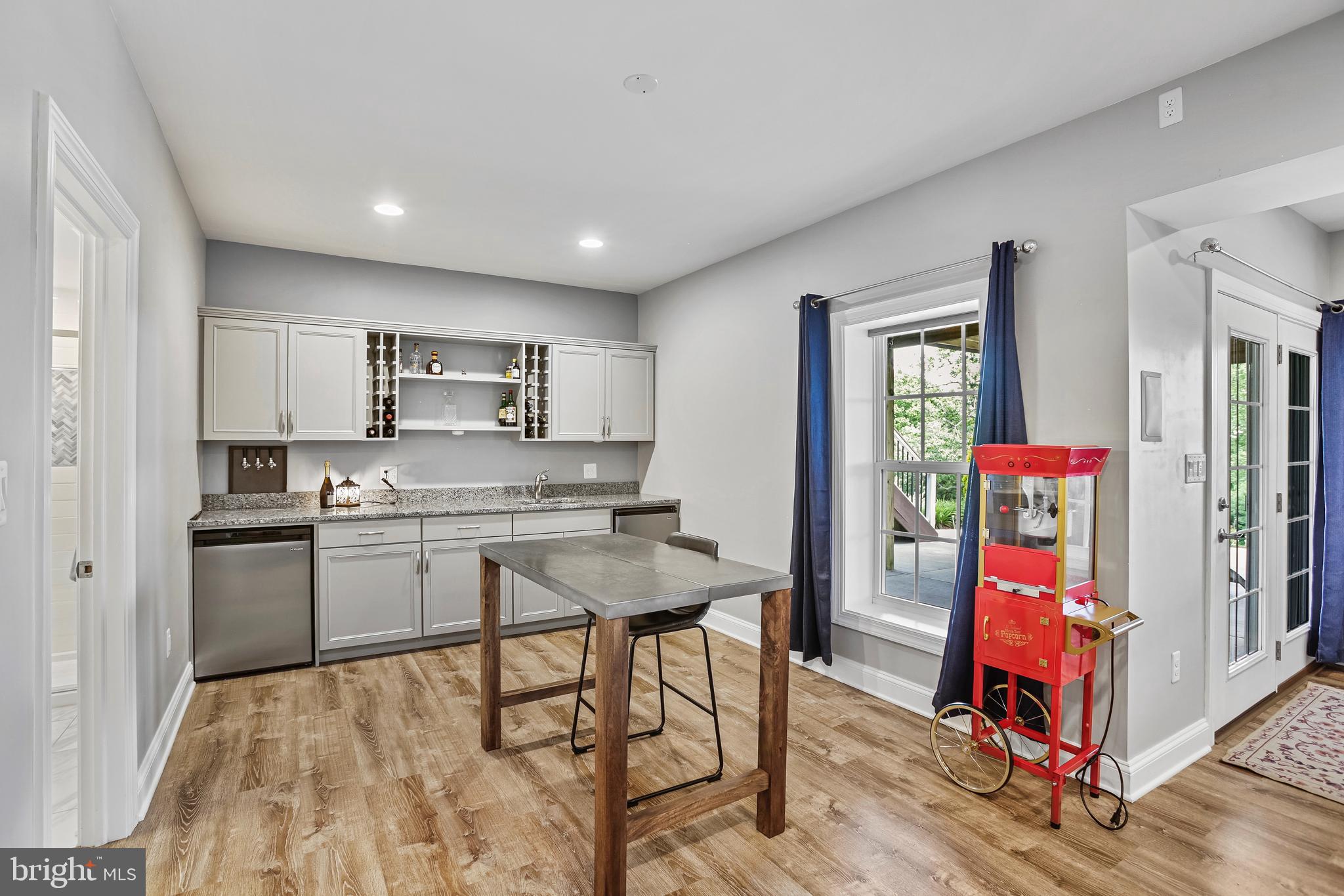 18604 Wild Raspberry Drive Purcellville, VA 20132 - Photo 35 of 58 a living room with stainless steel appliances kitchen island granite countertop furniture and a kitchen view