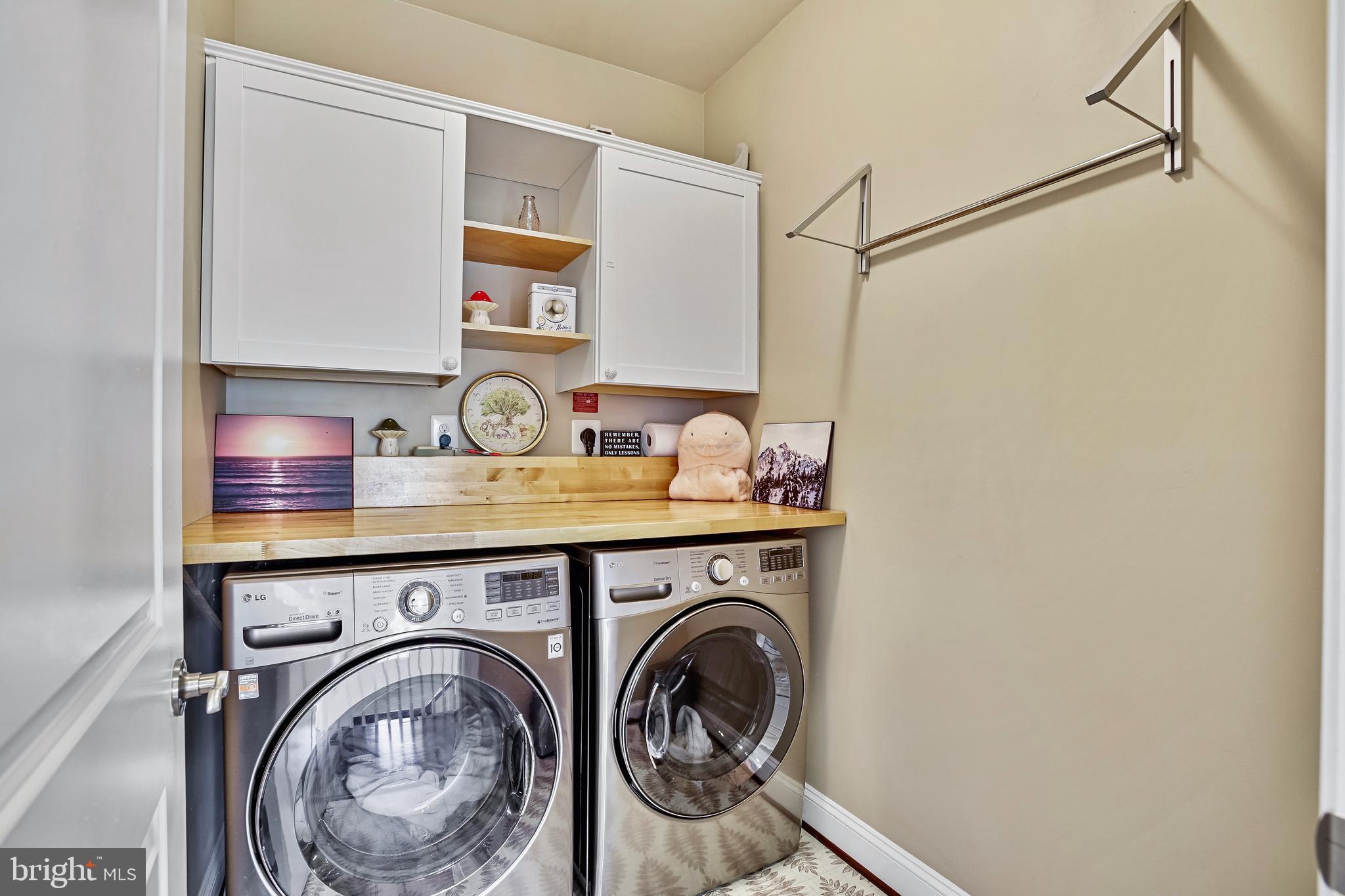18604 Wild Raspberry Drive Purcellville, VA 20132 - Photo 38 of 58 a storage room with washer and dryer