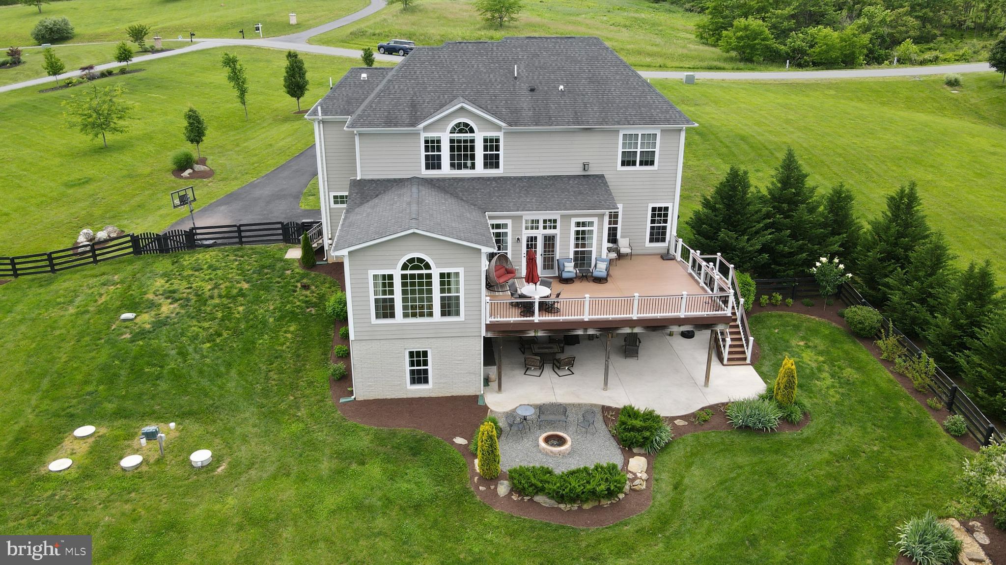 18604 Wild Raspberry Drive Purcellville, VA 20132 - Photo 40 of 58 an aerial view of a house with swimming pool and garden