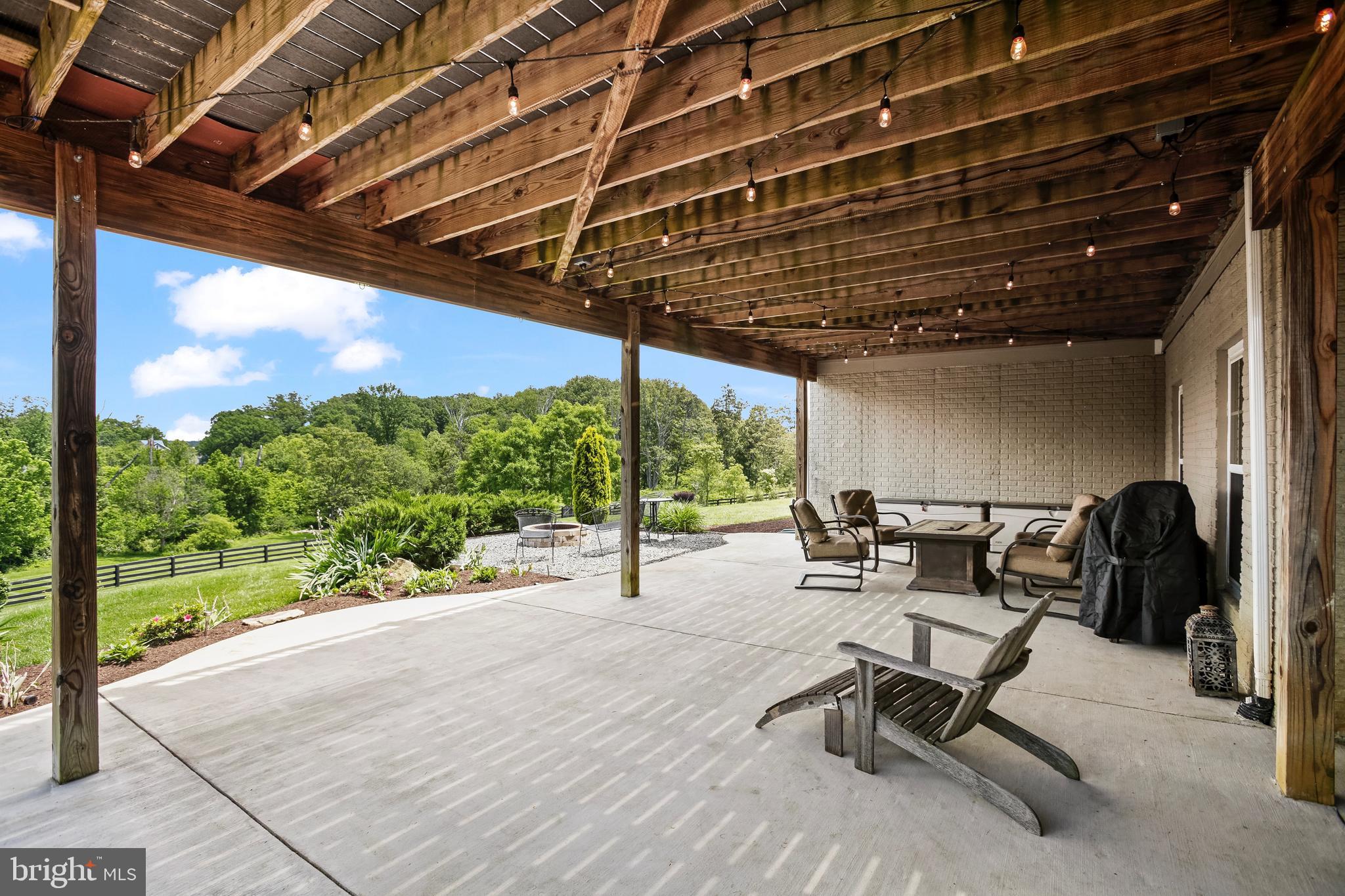 18604 Wild Raspberry Drive Purcellville, VA 20132 - Photo 43 of 58 a building outdoor space with patio view and a garden