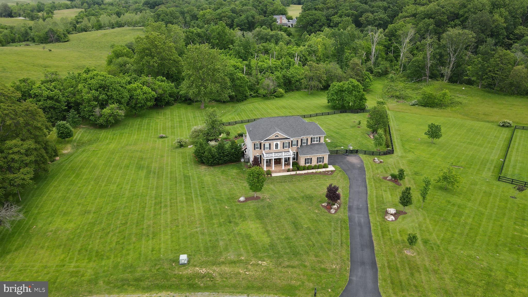 18604 Wild Raspberry Drive Purcellville, VA 20132 - Photo 45 of 58 a aerial view of a house with a yard