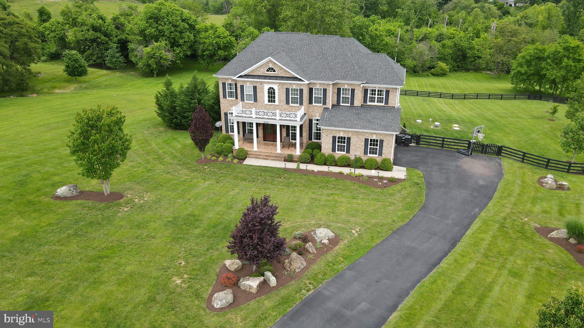 18604 Wild Raspberry Drive Purcellville, VA 20132 - Photo 48 of 58 a front view of a house with garden