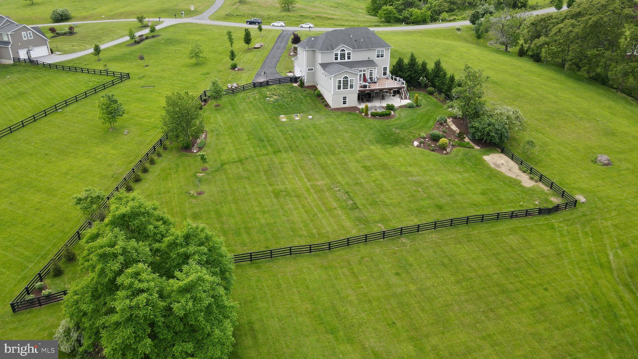 18604 Wild Raspberry Drive Purcellville, VA 20132 - Photo 53 of 58 an aerial view of a house with a garden
