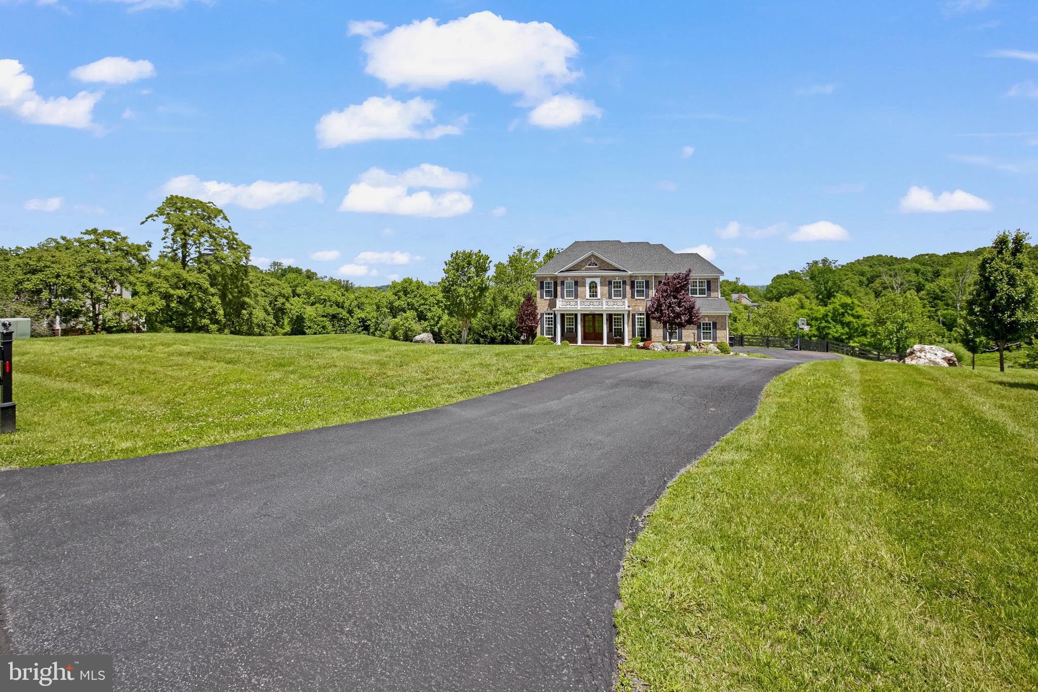 18604 Wild Raspberry Drive Purcellville, VA 20132 - Photo 58 of 58 a front view of a house with a yard and garage