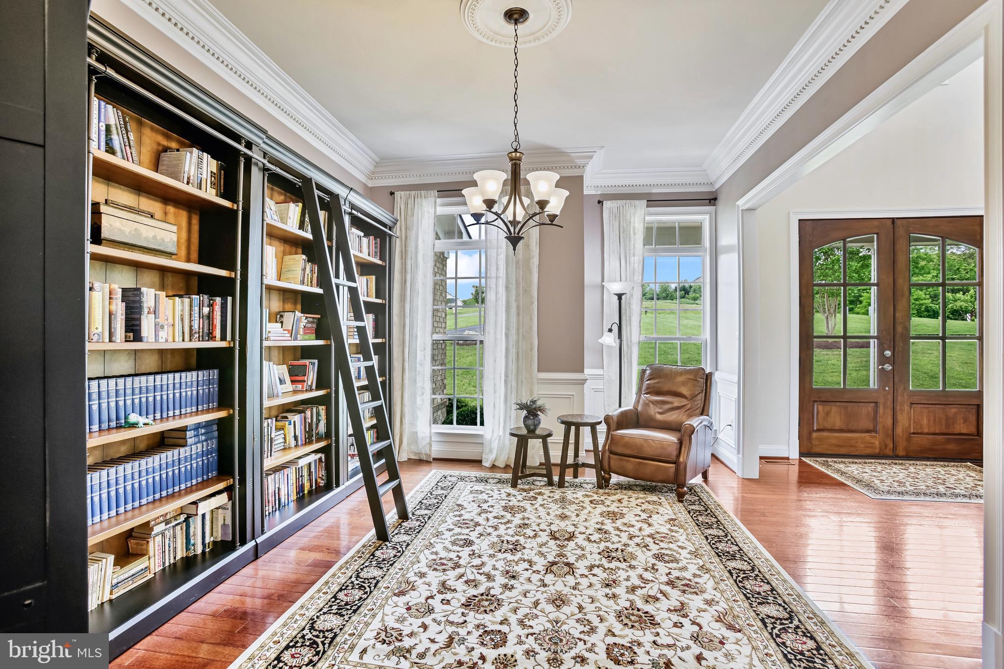 18604 Wild Raspberry Drive Purcellville, VA 20132 - Photo 7 of 58 a living room with furniture and a book shelf