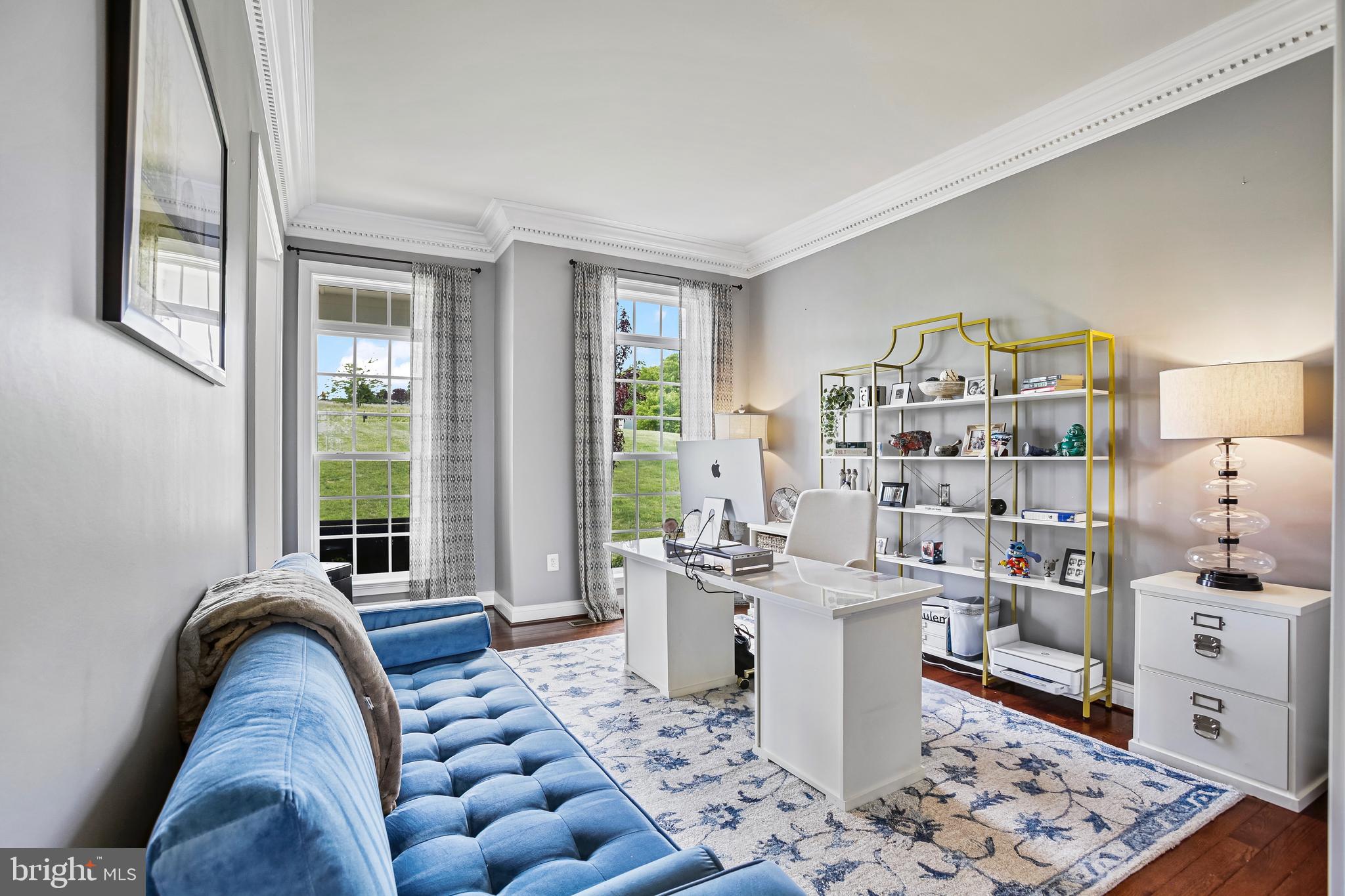 18604 Wild Raspberry Drive Purcellville, VA 20132 - Photo 10 of 58 a living room with furniture and a large window