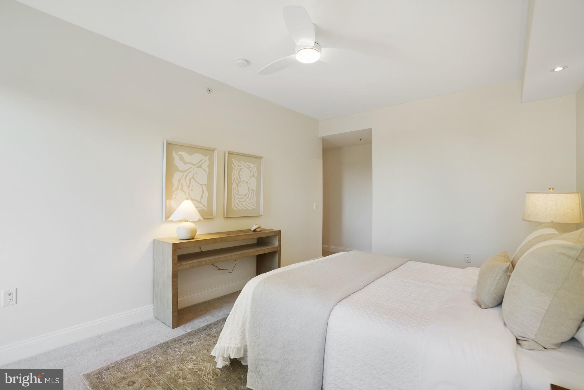 513 West Broad Street, Unit 510 Falls Church, VA 22046 - Photo 19 of 55 a bedroom with a bed and a table