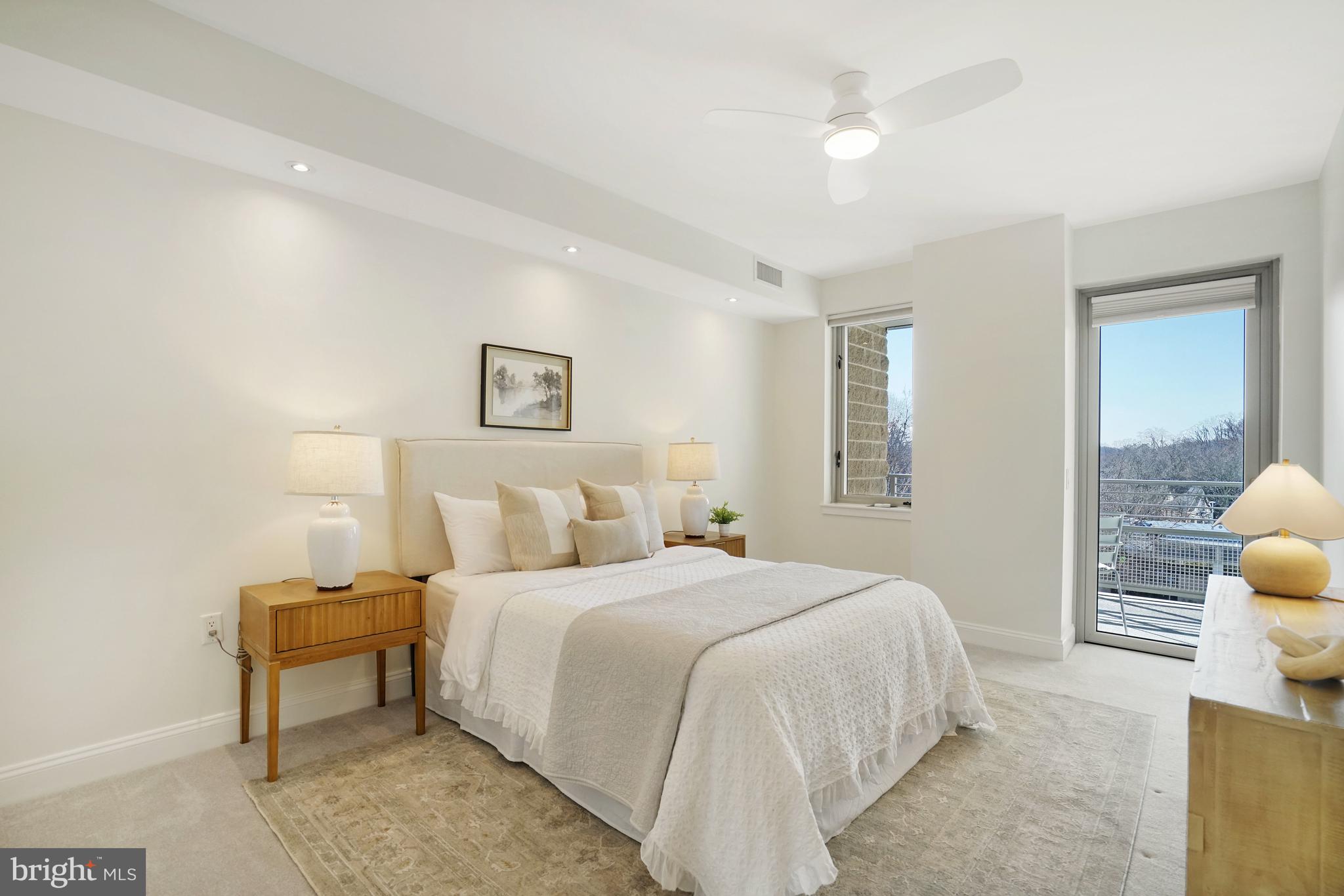 513 West Broad Street, Unit 510 Falls Church, VA 22046 - Photo 22 of 55 a bedroom with a bed and a lamp with the dresser