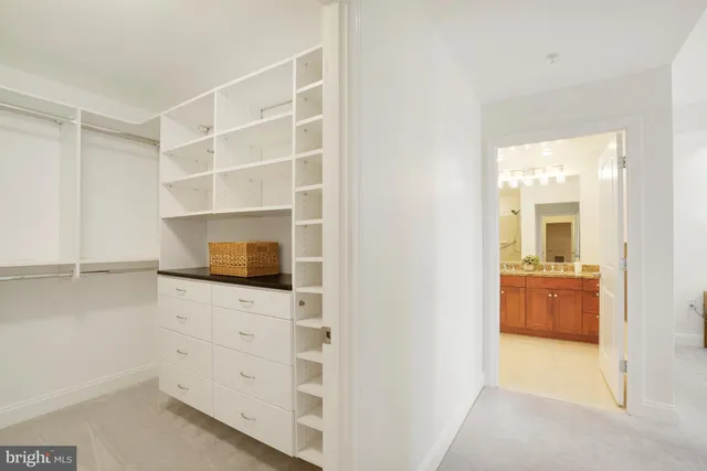 a room with a flat screen tv cabinet and a view of living room