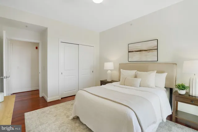 a bedroom with a bed and a mirror