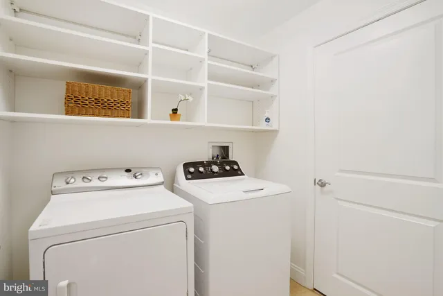 a view of a patio with couches table and chairs and potted plants