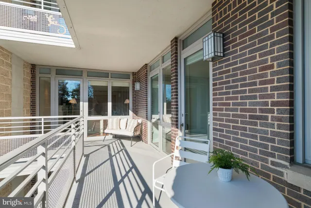 a view of balcony with two chairs and a table