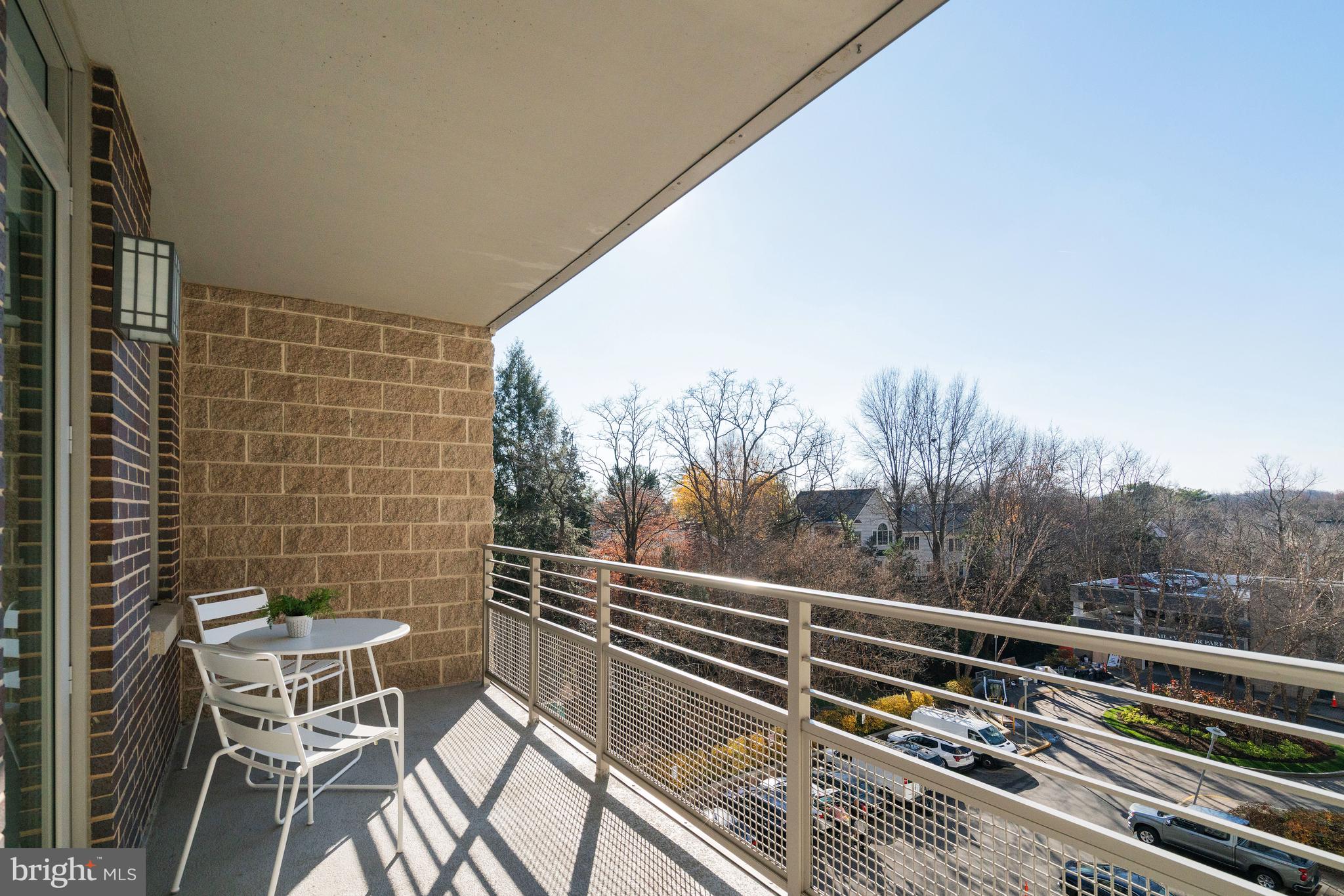 513 West Broad Street, Unit 510 Falls Church, VA 22046 - Photo 34 of 55 a view of balcony with two chairs and a table