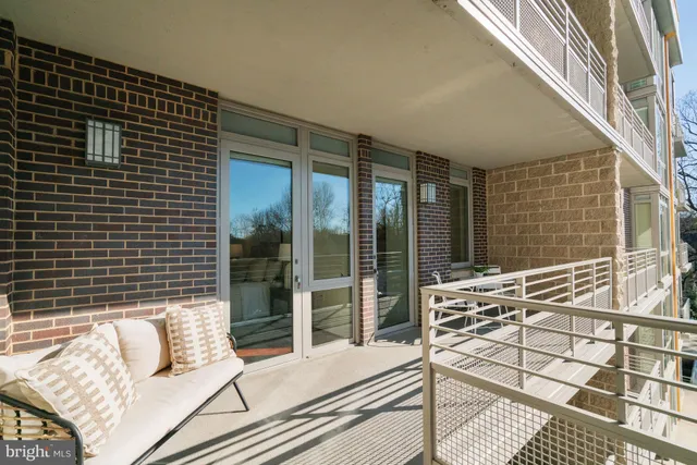 a city street lined with buildings and trees