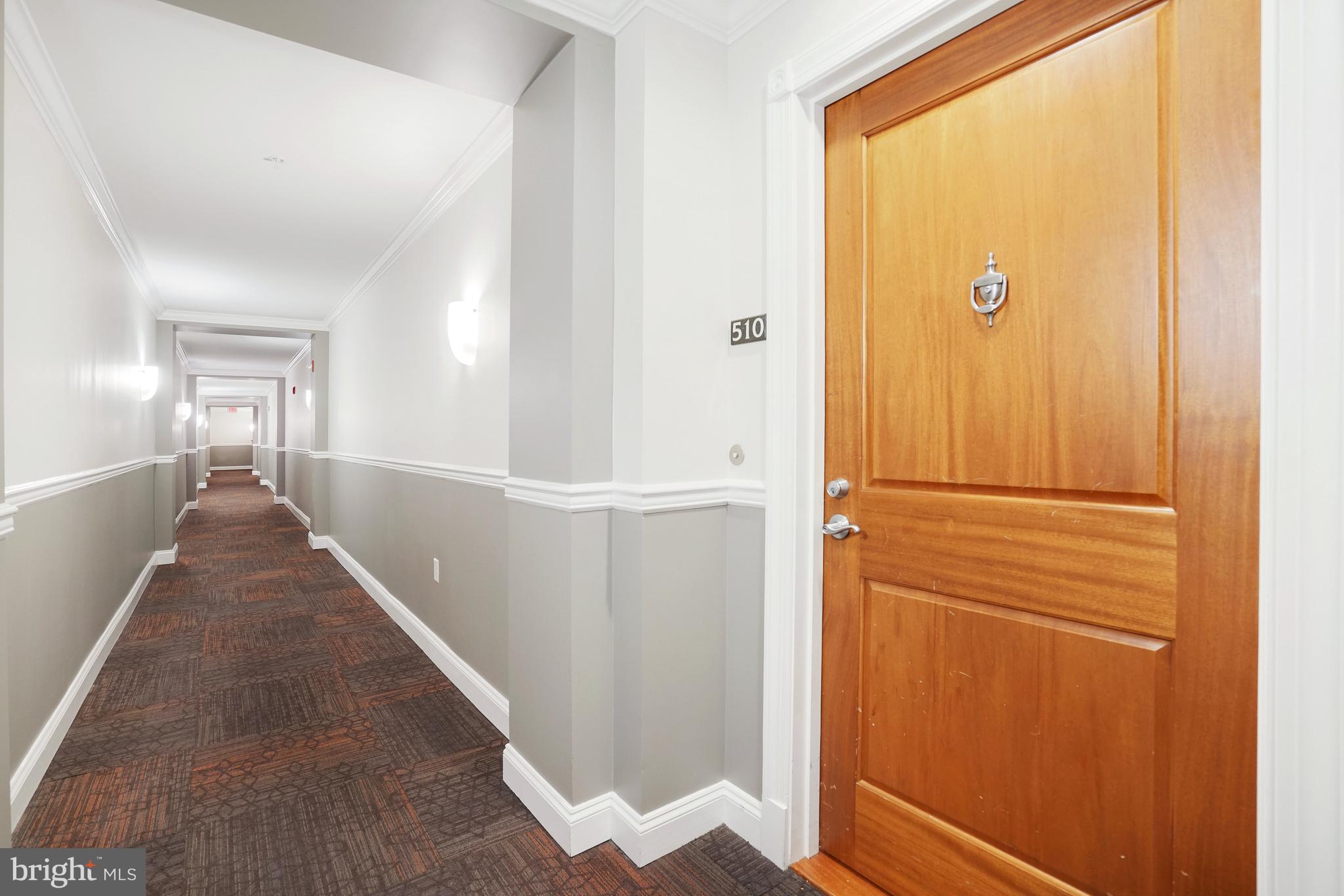513 West Broad Street, Unit 510 Falls Church, VA 22046 - Photo 36 of 55 a view of a hallway with wooden floor and entryway