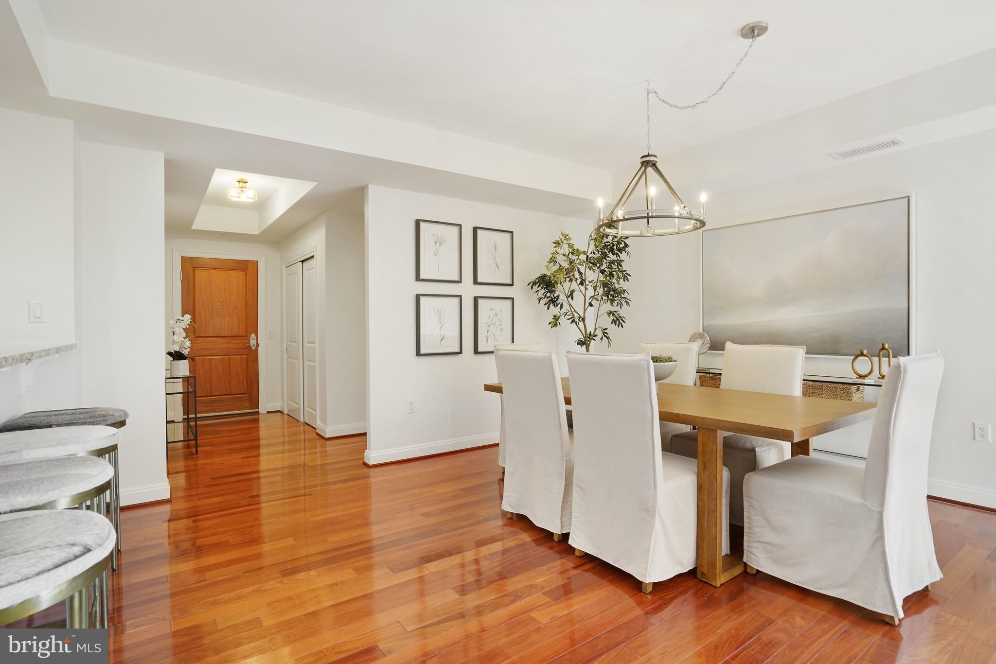 513 West Broad Street, Unit 510 Falls Church, VA 22046 - Photo 7 of 55 a view of a hallway with bathroom and wooden floor
