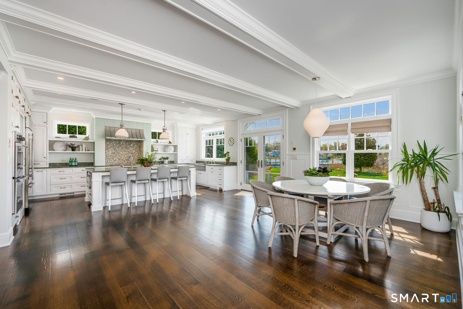 30 Shipway Road Darien, CT 06820 - Photo 11 of 40 a view of a dining room with furniture and wooden floor