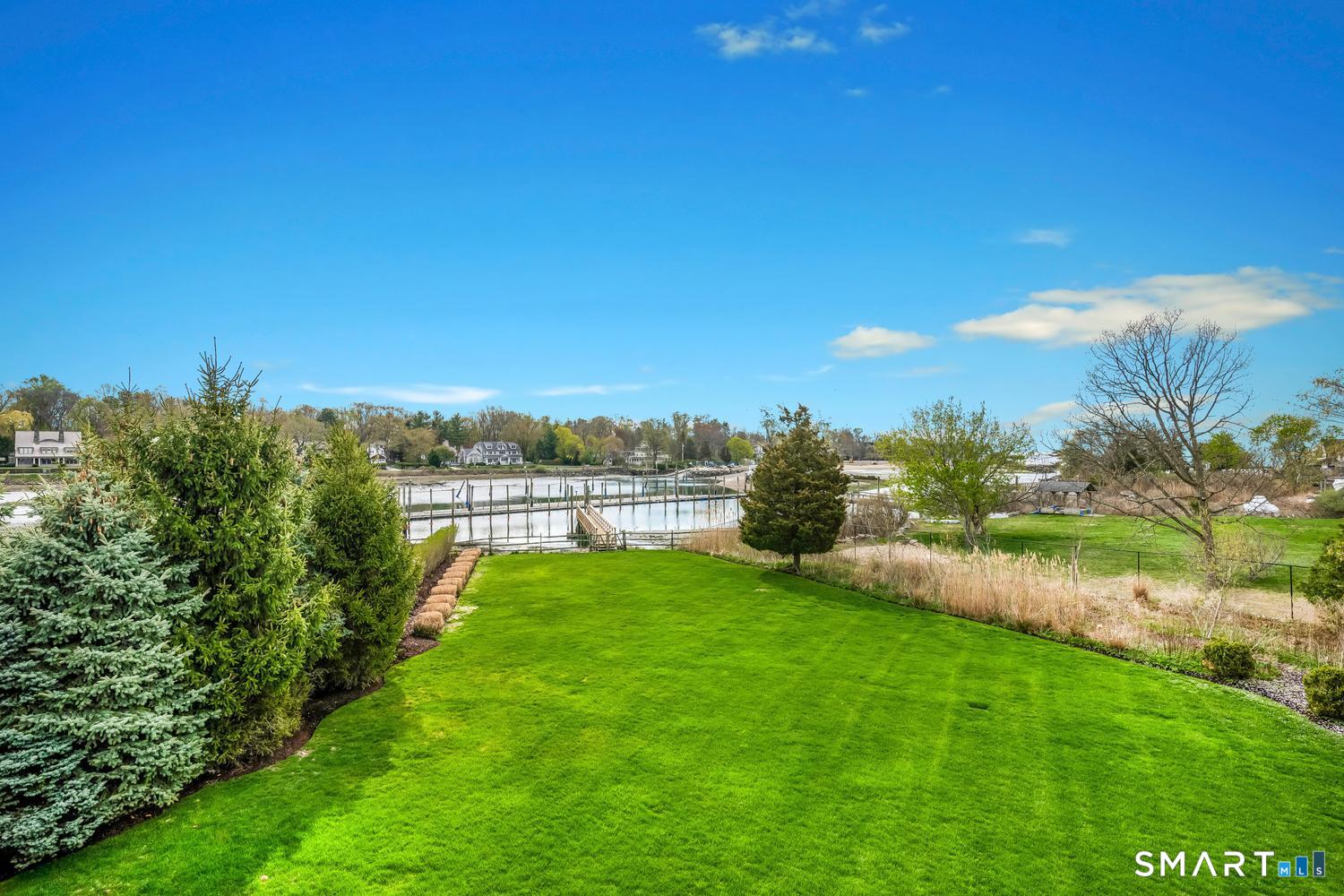 30 Shipway Road Darien, CT 06820 - Photo 19 of 40 a view of a garden with a building in the background