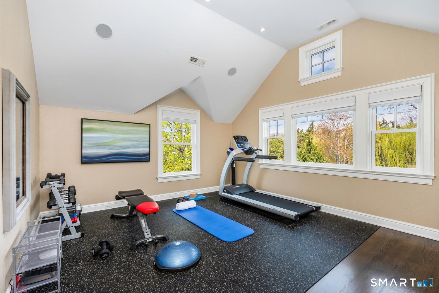30 Shipway Road Darien, CT 06820 - Photo 23 of 40 a room with gym equipment and windows