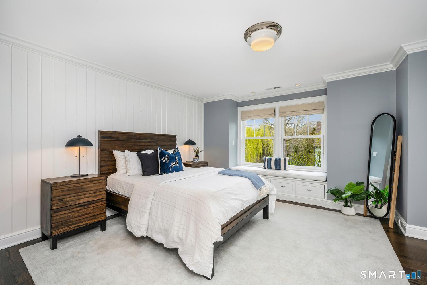 30 Shipway Road Darien, CT 06820 - Photo 24 of 40 a bedroom with a bed and a potted plant