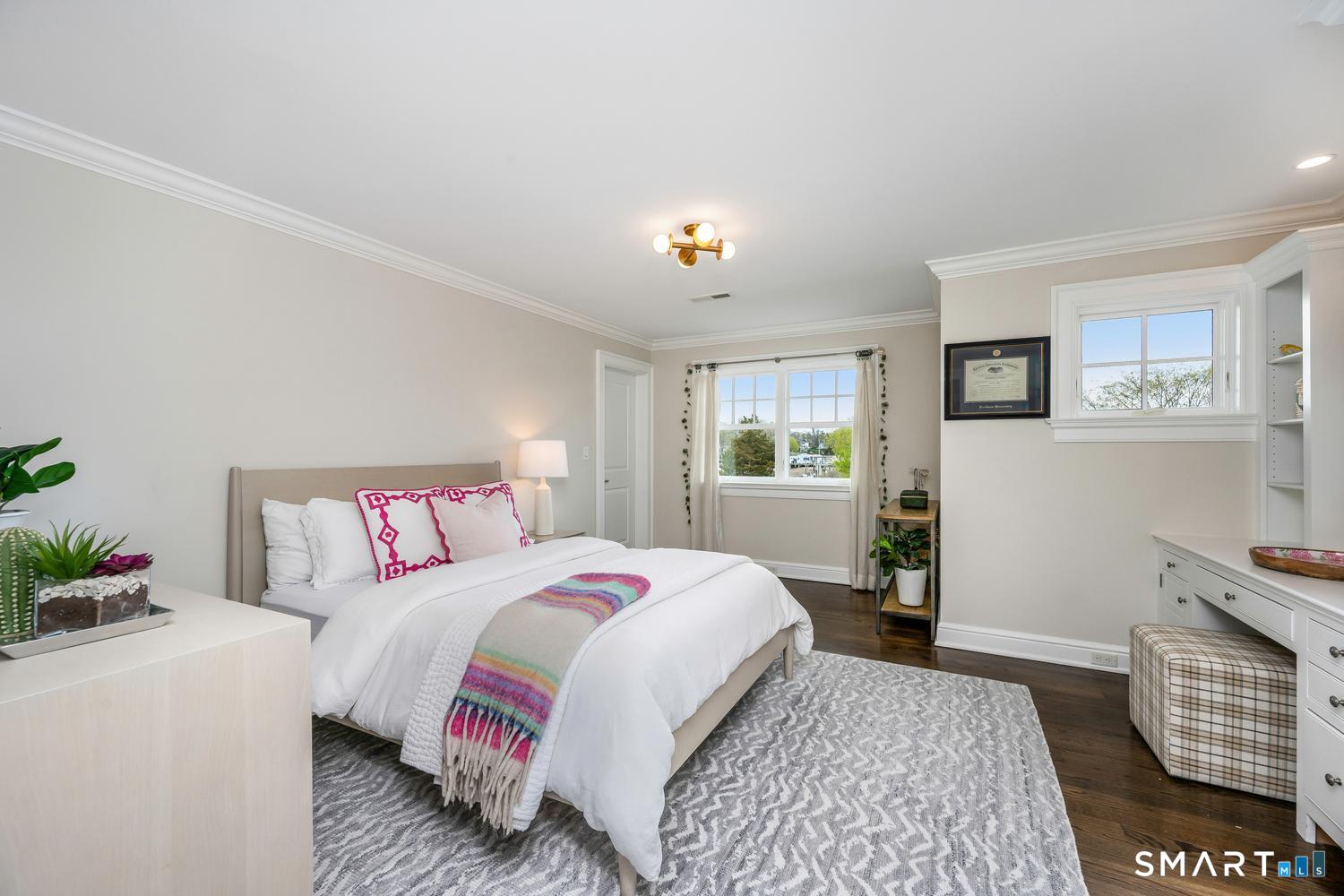 30 Shipway Road Darien, CT 06820 - Photo 25 of 40 a bedroom with a bed and wooden floor