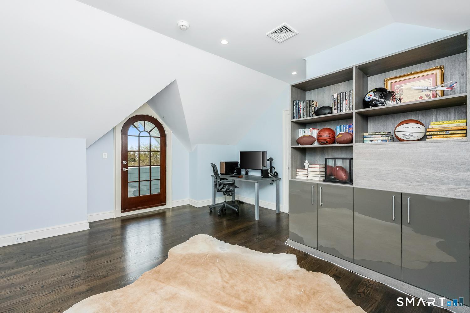 30 Shipway Road Darien, CT 06820 - Photo 27 of 40 a living room with fireplace furniture and a window