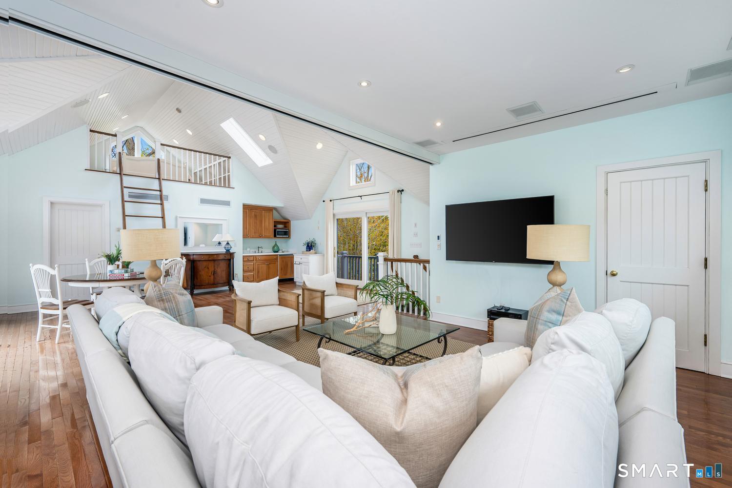 30 Shipway Road Darien, CT 06820 - Photo 32 of 40 a living room with furniture and a flat screen tv