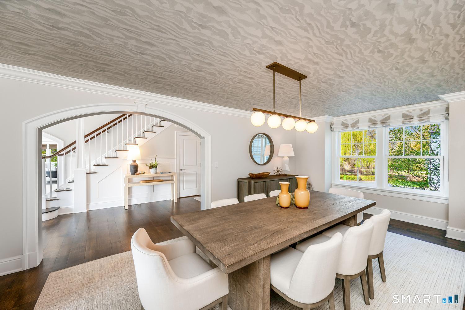 30 Shipway Road Darien, CT 06820 - Photo 6 of 40 a living room with table chairs and a large window